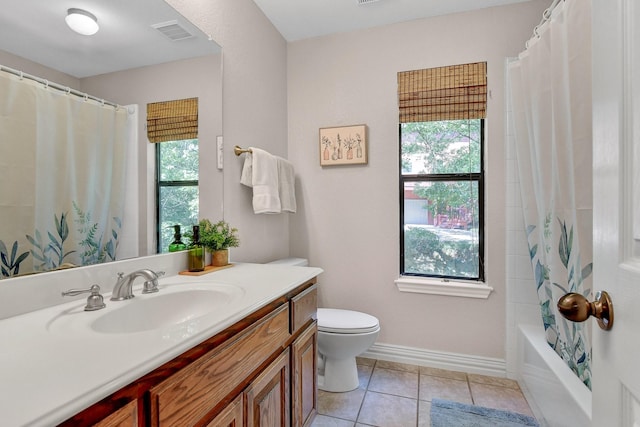 full bathroom with toilet, tile patterned flooring, visible vents, and a wealth of natural light