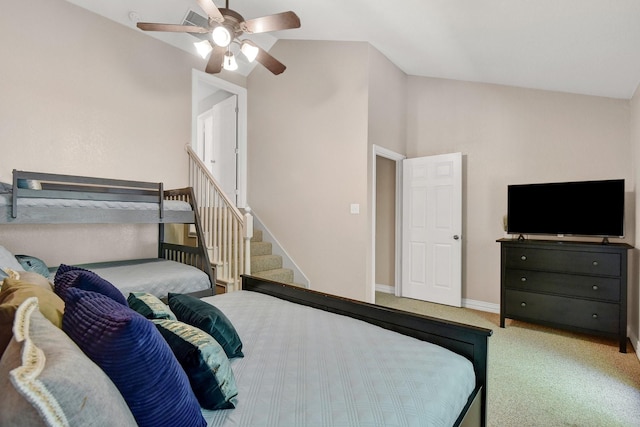 carpeted bedroom with lofted ceiling, visible vents, baseboards, and a ceiling fan