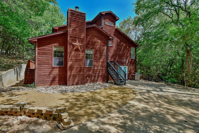 view of home's exterior featuring a chimney