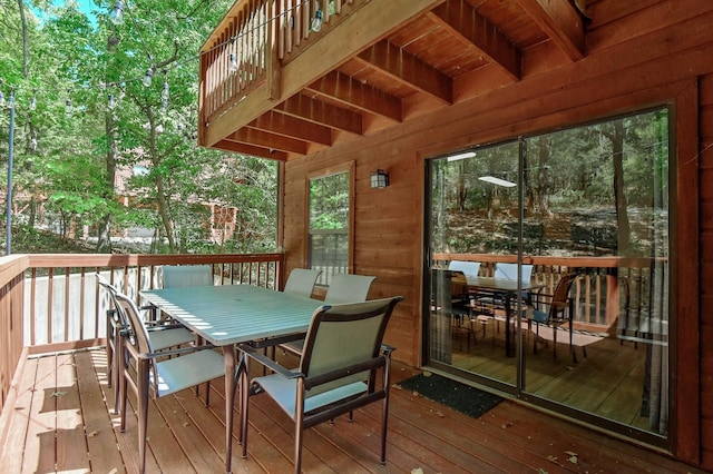 wooden deck featuring outdoor dining area