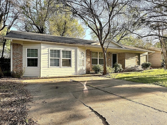 single story home with brick siding