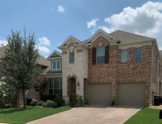 traditional home with a garage, stone siding, brick siding, and driveway