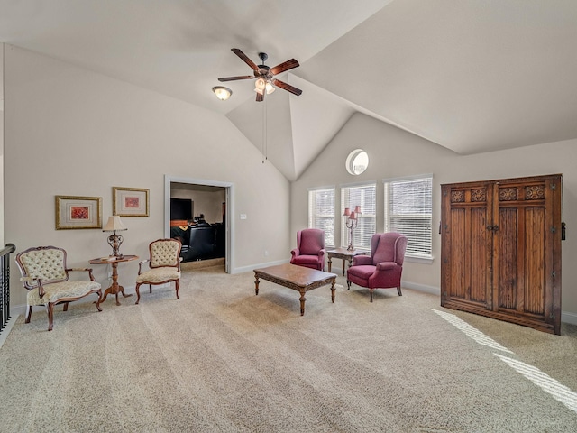 living area with a ceiling fan, baseboards, high vaulted ceiling, and carpet flooring