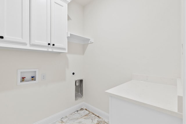washroom with cabinet space, baseboards, marble finish floor, hookup for an electric dryer, and washer hookup