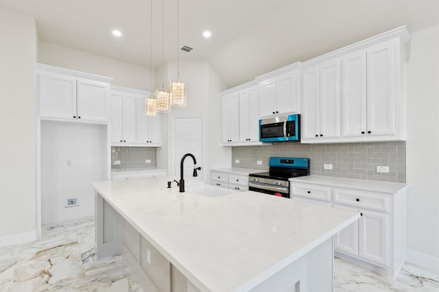 kitchen featuring stainless steel appliances, a sink, visible vents, white cabinetry, and marble finish floor