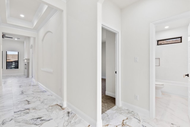 hall with baseboards, marble finish floor, a tray ceiling, crown molding, and recessed lighting