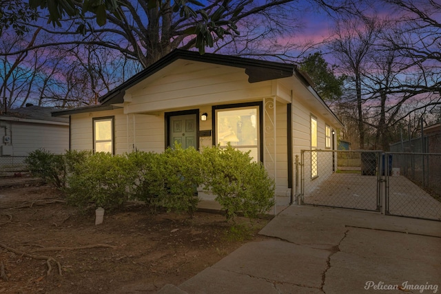 view of front of property featuring a gate and fence