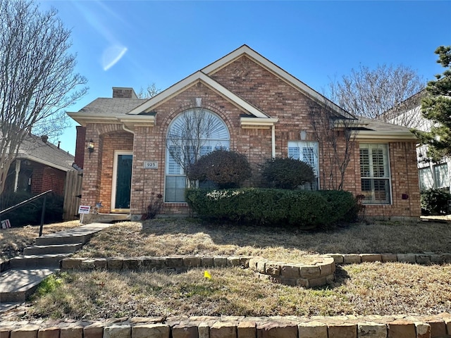 view of front of home featuring brick siding