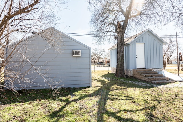 view of outbuilding featuring entry steps and an outbuilding