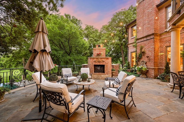 900 Kingsbury Way, Southlake, TX 76092 - view of patio / terrace featuring view of wooded area and an outdoor living space with a fireplace