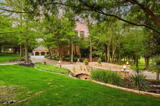 900 Kingsbury Way, Southlake, TX 76092 - view of grassy yard with a garage and driveway