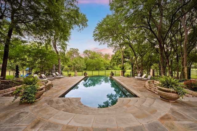 900 Kingsbury Way, Southlake, TX 76092 - pool at dusk with a patio and view of scattered trees