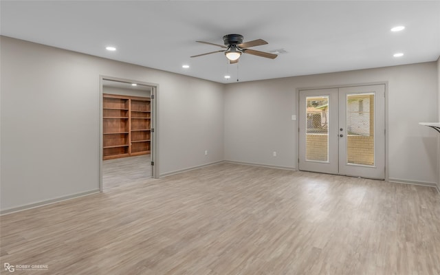 spare room with recessed lighting, light wood-style flooring, and french doors