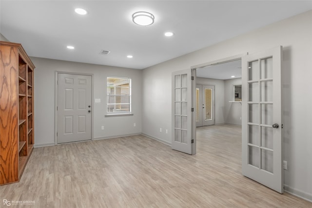 spare room with recessed lighting, visible vents, baseboards, light wood-style floors, and french doors