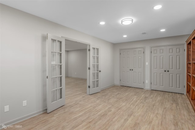 spare room with baseboards, french doors, recessed lighting, and light wood-style floors