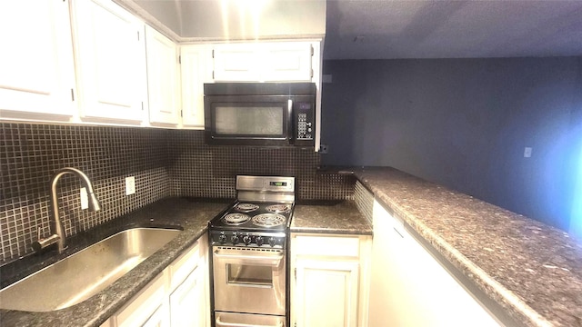 kitchen with electric range, white cabinets, a sink, black microwave, and backsplash