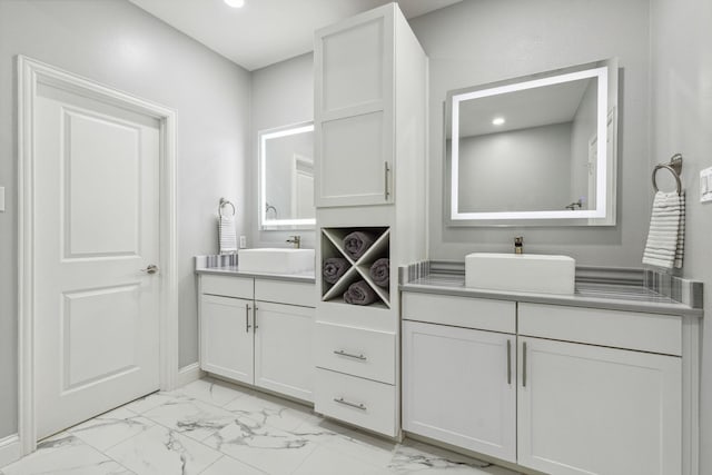 612 Skyline Bluff Dr, Fort Worth, TX 76102 - full bathroom featuring marble finish flooring, two vanities, recessed lighting, and baseboards