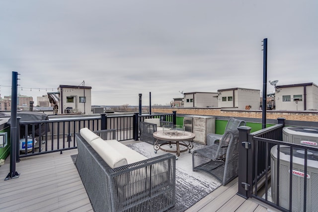 wooden terrace featuring central AC unit