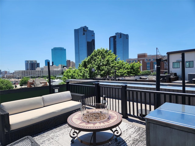 612 Skyline Bluff Dr, Fort Worth, TX 76102 - deck with a skyline view, central AC unit, and an outdoor hangout area