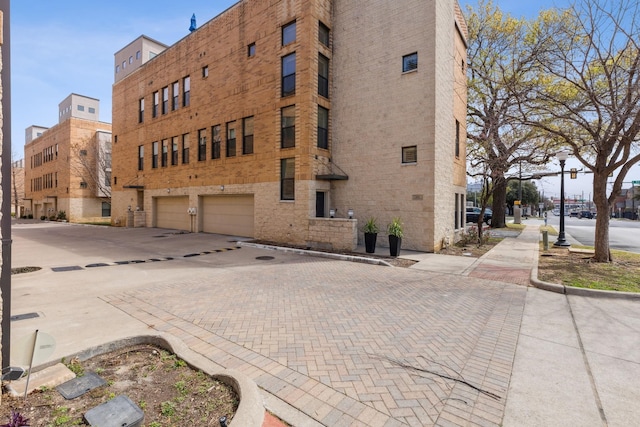 612 Skyline Bluff Dr, Fort Worth, TX 76102 - view of building exterior with a garage and driveway