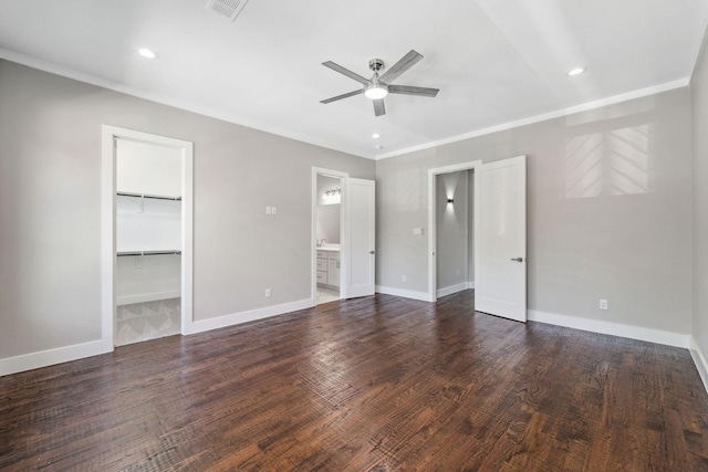 unfurnished bedroom with dark wood-style floors, visible vents, and baseboards