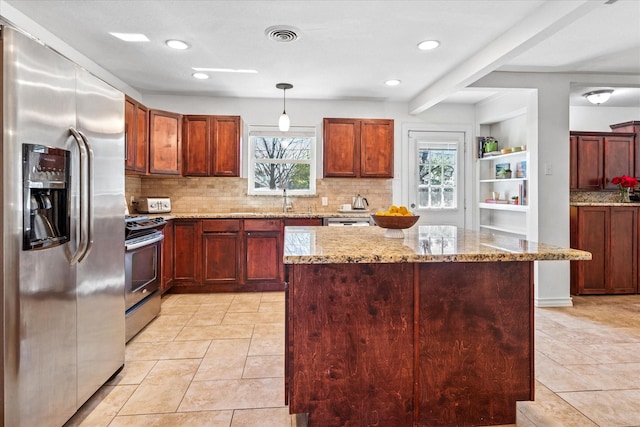 kitchen featuring stainless steel appliances, light stone counters, light tile patterned flooring, and tasteful backsplash