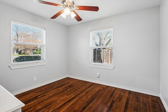 unfurnished room with a ceiling fan, baseboards, and wood finished floors