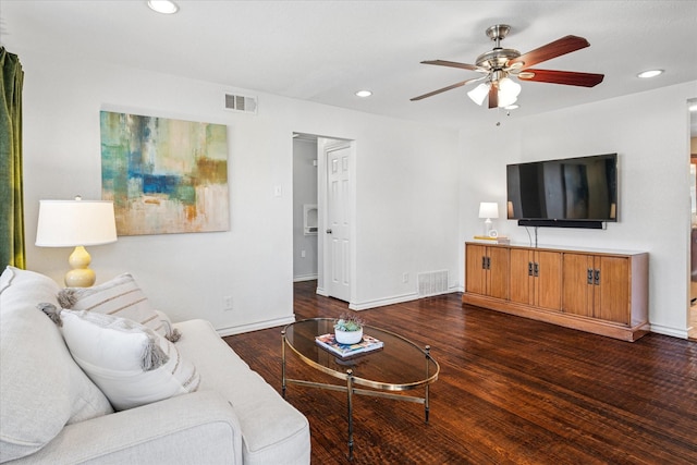 living room with visible vents, wood finished floors, and recessed lighting