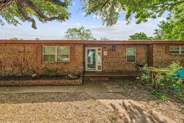 ranch-style house with brick siding