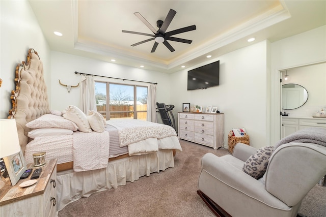 bedroom with ornamental molding, a tray ceiling, access to outside, and carpet flooring