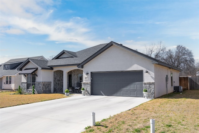 view of front of property featuring a front lawn, concrete driveway, an attached garage, and stucco siding