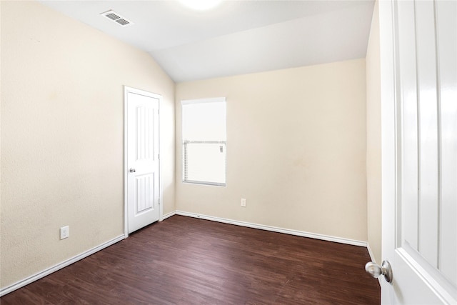 302 Triple Crown Ln, Ponder, TX 76259 - empty room with vaulted ceiling, dark wood-style flooring, visible vents, and baseboards