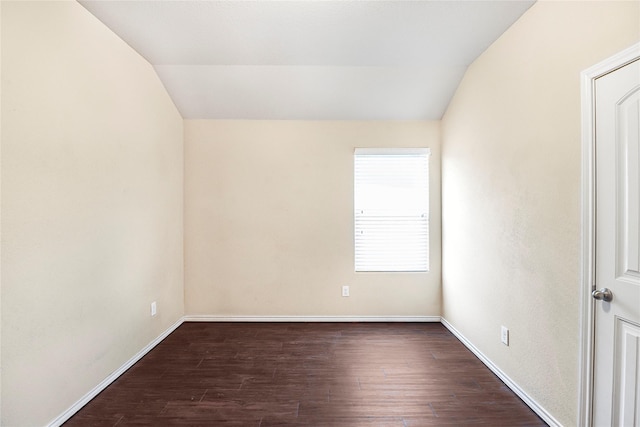 302 Triple Crown Ln, Ponder, TX 76259 - empty room featuring baseboards, vaulted ceiling, and dark wood-type flooring