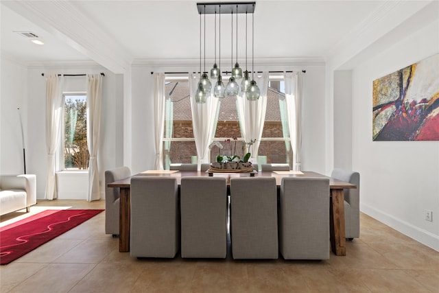 dining area featuring visible vents, crown molding, baseboards, and light tile patterned floors