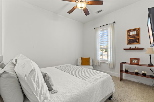 bedroom featuring ceiling fan, carpet floors, visible vents, and baseboards