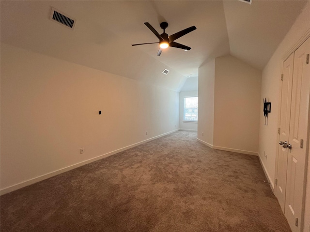 bonus room featuring vaulted ceiling, carpet, visible vents, and baseboards