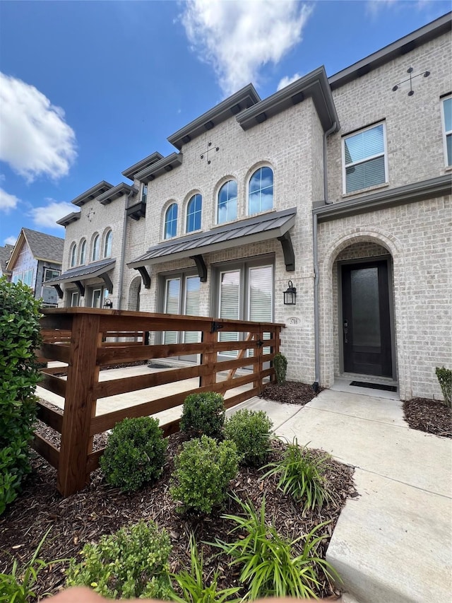 exterior space with brick siding