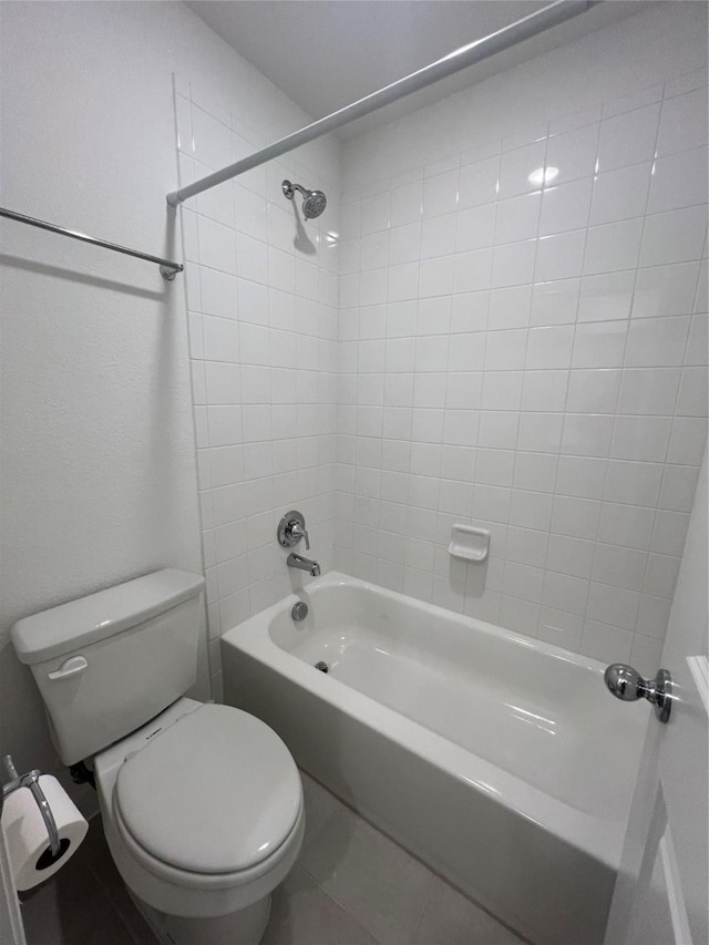 bathroom featuring toilet and shower / washtub combination