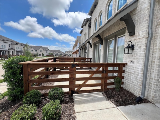 view of gate featuring a residential view