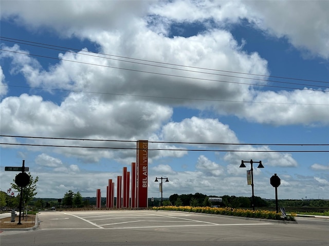 view of street with traffic signs and curbs