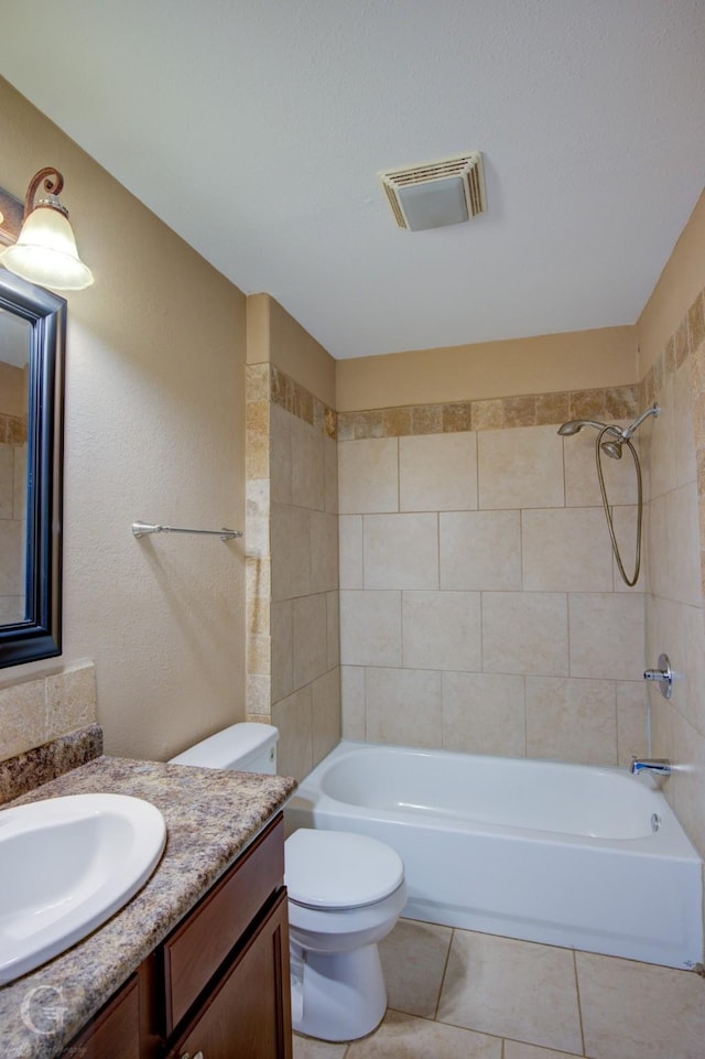 full bath featuring tile patterned flooring, toilet, vanity, bathing tub / shower combination, and visible vents