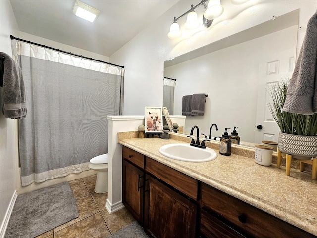 full bathroom with curtained shower, vanity, toilet, and tile patterned floors