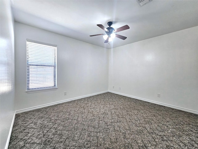 empty room with a ceiling fan, baseboards, visible vents, and carpet flooring