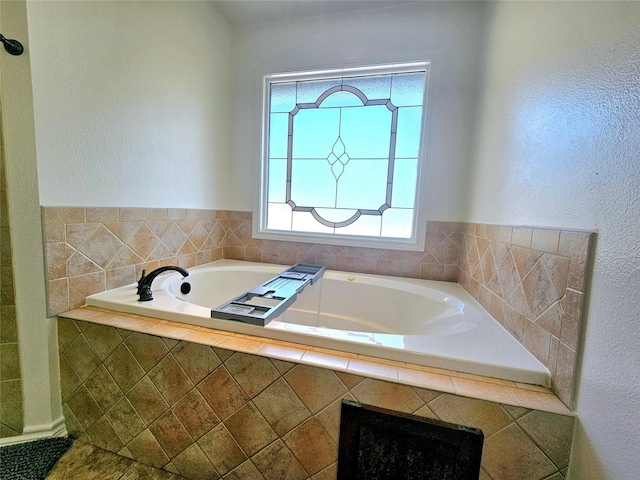 bathroom with a garden tub