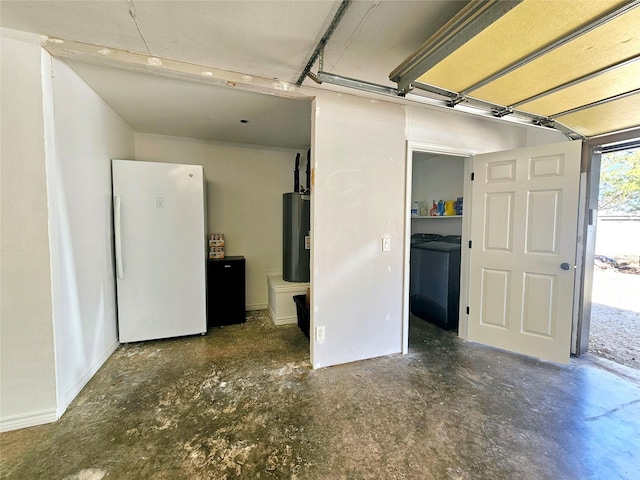 garage with freestanding refrigerator and water heater