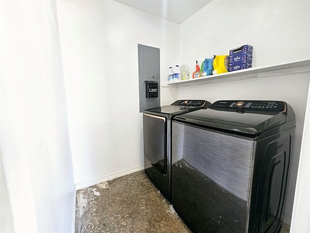 washroom with laundry area, electric panel, baseboards, and independent washer and dryer