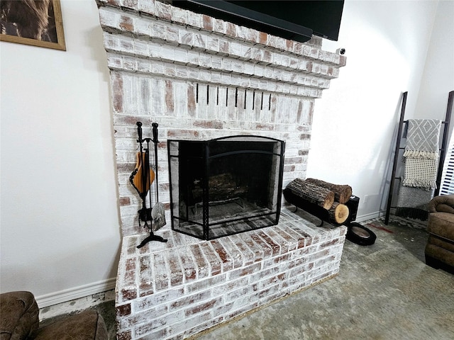 interior details with a fireplace and baseboards