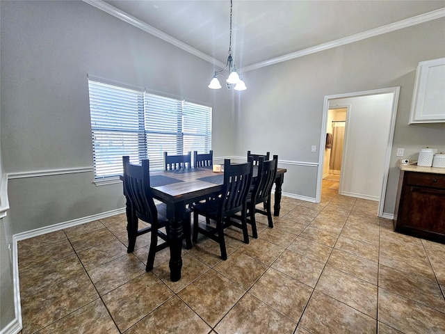 dining space featuring an inviting chandelier, baseboards, ornamental molding, and light tile patterned flooring