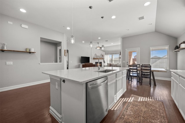 kitchen with a kitchen island with sink, dark wood-type flooring, a sink, white cabinets, and dishwasher