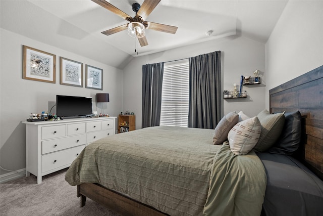 bedroom with lofted ceiling, carpet, baseboards, and ceiling fan